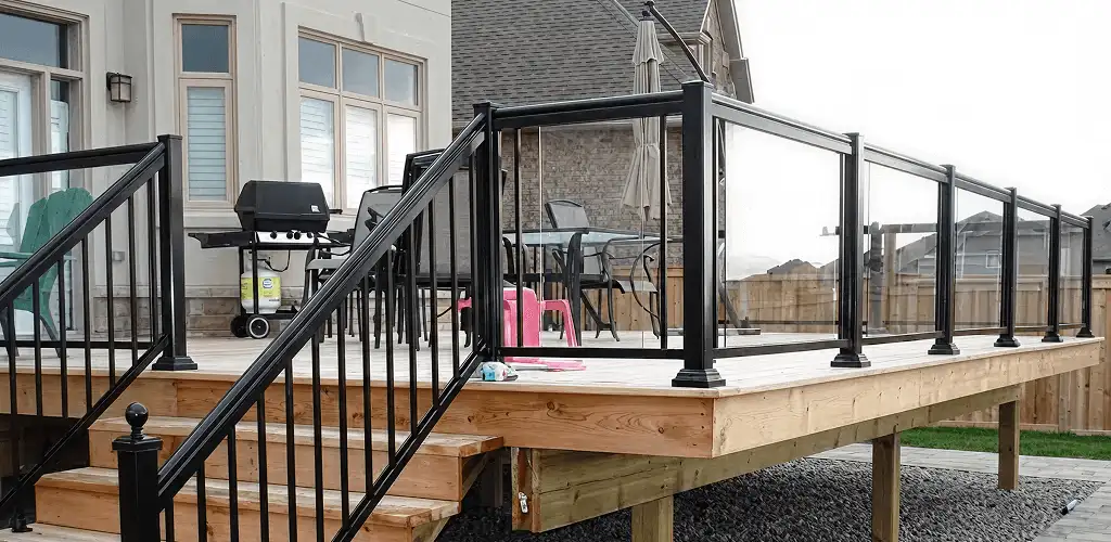 Handrail installation on a deck staircase for safety and code compliance in Dallas, TX